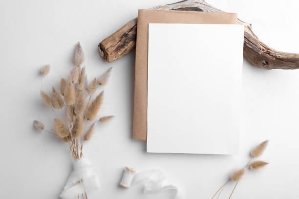 istock Wedding stationery invitation card mockup 5x7 on white background with envelop and boho decor, vertical card 1386712908