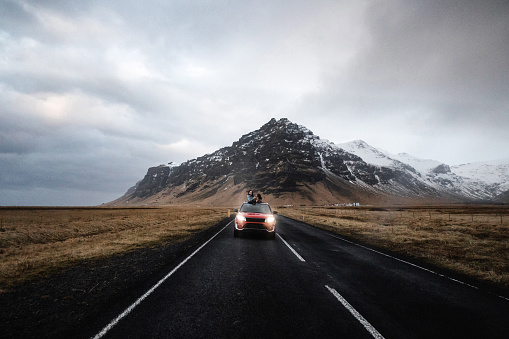 Two women enjoy the traveling in Iceland in aa car