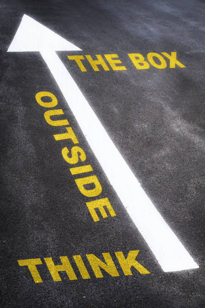 istock Think outside the box written on the road 1386713510