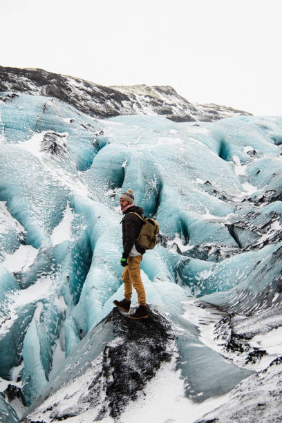 istock The man standing on glacier in Iceland in winter 1386714425