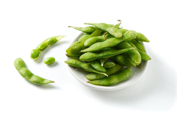 green soybeans on white background stock photo
