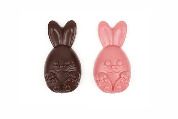istock Composition of chocolate figurines. Chocolate bunny. Chocolate eggs on a white background. Place for the test. 1386716835