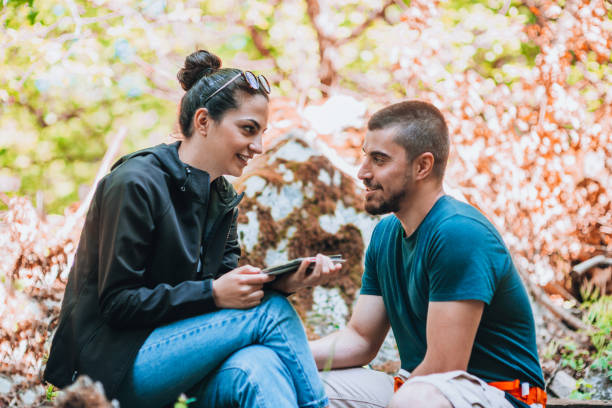 istock Couple having a break from trekking 1386718656