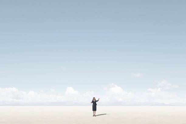 istock Blindfolded Businesswoman Struggling For Direction 1386720468