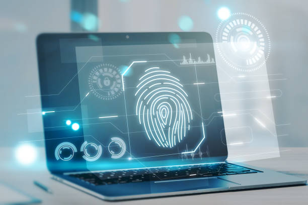 istock Close up of laptop computer with abstract glowing fingerprint interface on blurry background. Login and authorization concept. Double exposure. 1386722570