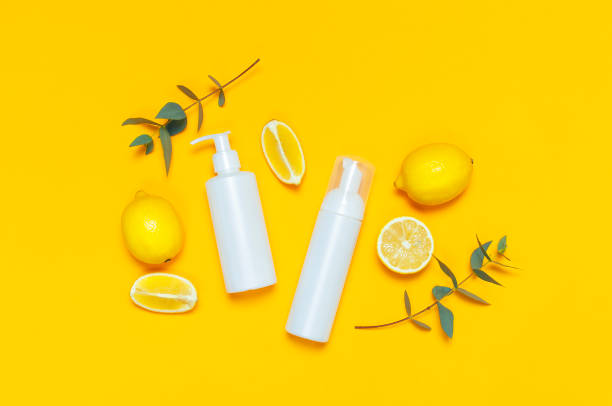 istock Whites Cosmetic bottle containers fresh lemon orange eucalyptus on yellow background top view flat lay copy space. Blank label for branding mock-up Natural beauty product concept Shower Gel Soap Cream 1386722883