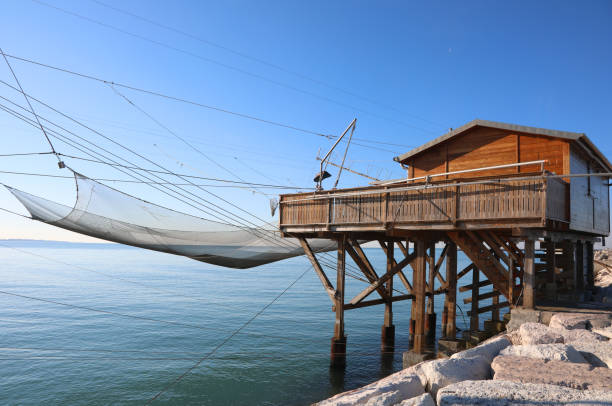 istock Large fishing hut and the huge nets for catching fish 1386725211