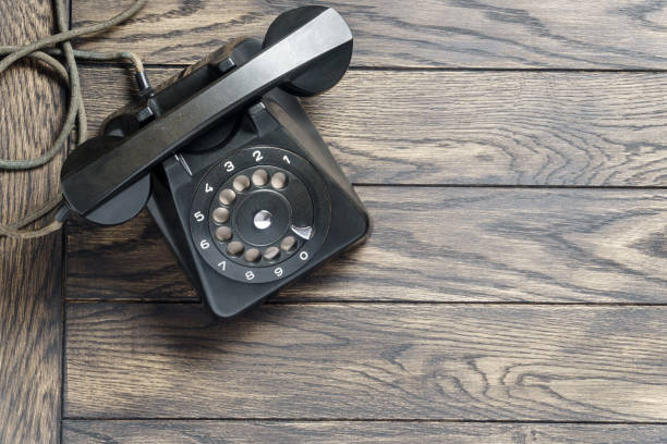 istock Black vintage telephone on table above with copy space 1386725968