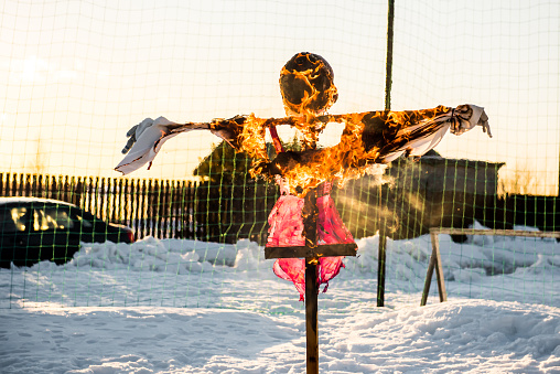 The effigy at the Shrovetide festival is burning.