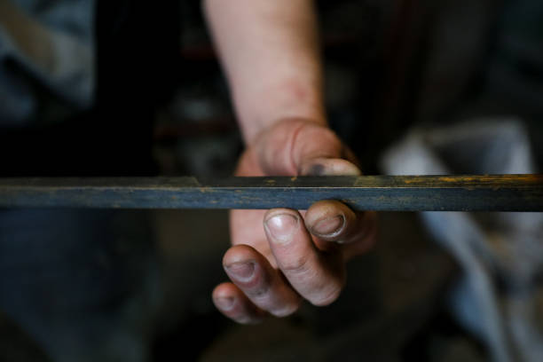 istock MINSK, BELARUS - 18 FEBRUARY, 2022: blacksmith working in the forge 1386730370