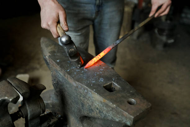 istock MINSK, BELARUS - 18 FEBRUARY, 2022: blacksmith working in the forge 1386730634