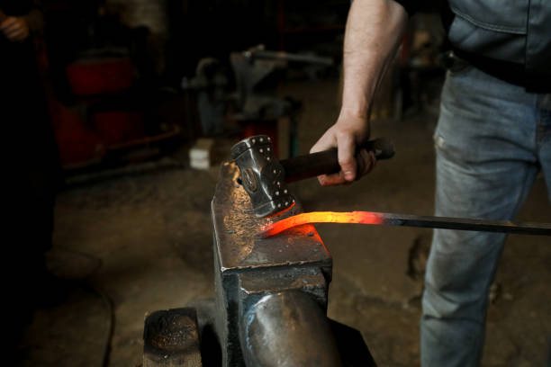 istock MINSK, BELARUS - 18 FEBRUARY, 2022: blacksmith working in the forge 1386731735