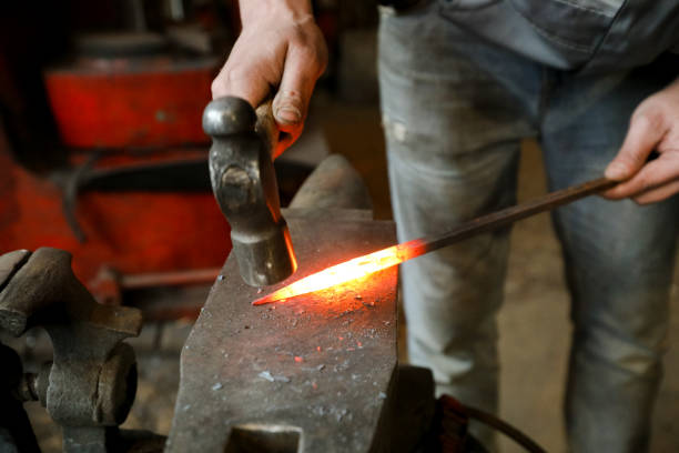 istock MINSK, BELARUS - 18 FEBRUARY, 2022: blacksmith working in the forge 1386731738