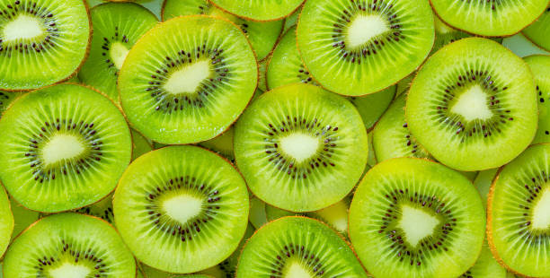istock Kiwi Macro,Fresh Kiwi fruit sliced use for background,slice of kiwi fruit on a full frame. horizontal format 1386733094