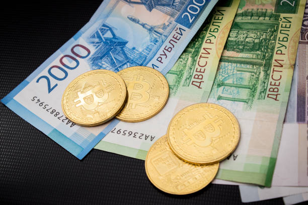 Bitcoins and russian rubles stock photo