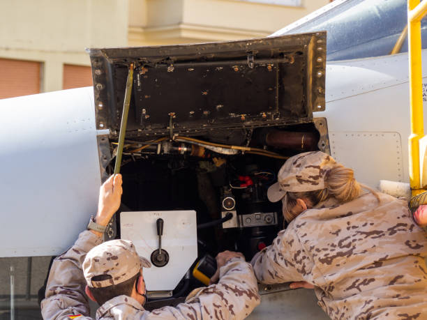 Zamora, Spain - March 20, 2022: Air Force female serviceman handling a fighter plane at a warplane exhibition. HD image.