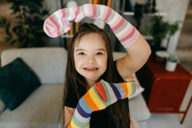 istock Cute smiling down syndrome girl 1386736386