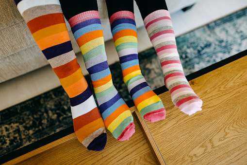 Close up of a colorful soft socks on child feet