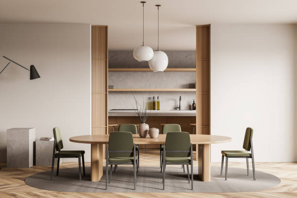 istock Light kitchen interior with chairs and table, dining room and appliances 1386737658