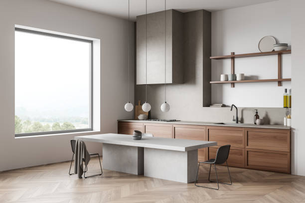 istock Modern dining interior with table and seats, shelves and panoramic window 1386739007