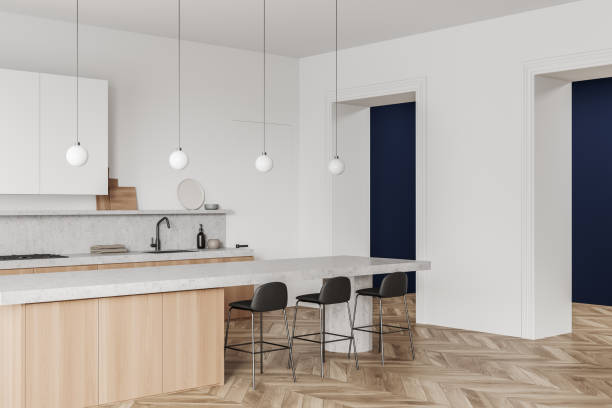 istock Corner view on bright kitchen room interior with island, barstools 1386739527