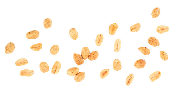 istock Top view of roasted peanuts snack isolated on a white background. Fried and salted peanuts. 1386751104
