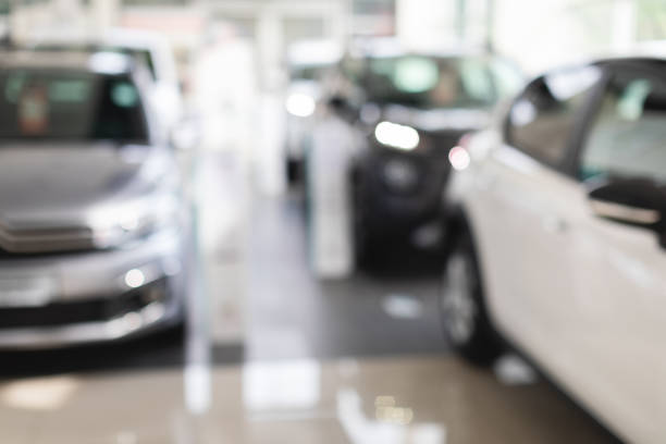 istock Luxury automobiles in vip showroom, blurred background 1386751974
