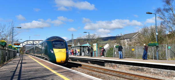 Pontyclun, Wales - March 2022:  High speed train operated by Great Western Railway passing through the railway station in the south Wales village of Pontyclun on its way to Swansea