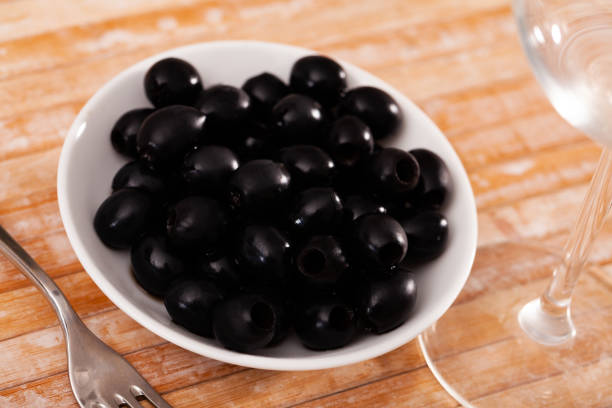istock Pickled black olives in white bowl 1386759818