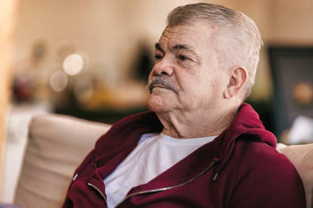 istock Aging Portrait senior man thinking  at home 1386762062
