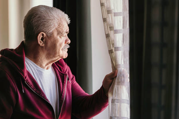 istock Aging Portrait senior man thinking  at home 1386762085