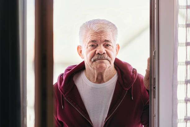 istock Aging Portrait senior man thinking  at home 1386762098