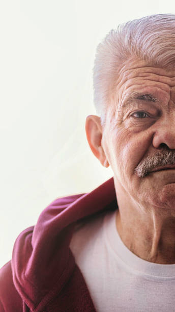 istock Aging Portrait senior man thinking  at home 1386762100