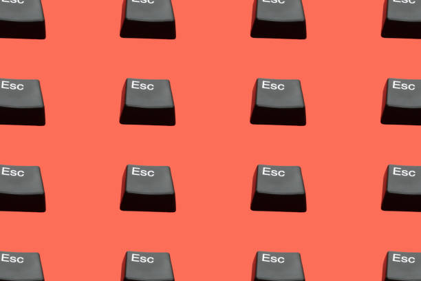 Creative seamless pattern of Esc buttons (escape keyboard key) on red background. Isometric view. Escape from dept, love, bad situation, relationship etc. Flat lay. Creative seamless pattern of Esc buttons (escape keyboard key) on red background. Isometric view. Escape from dept, love, bad situation, relationship etc. Flat lay. undo key stock pictures, royalty-free photos & images