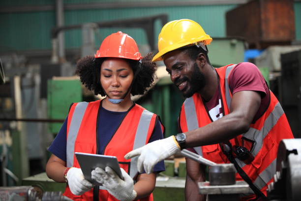 istock African American engineer skills quality, maintenance, training industry factory worker , warehouse Workshop for factory operators, mechanical engineering team production. 1386767455