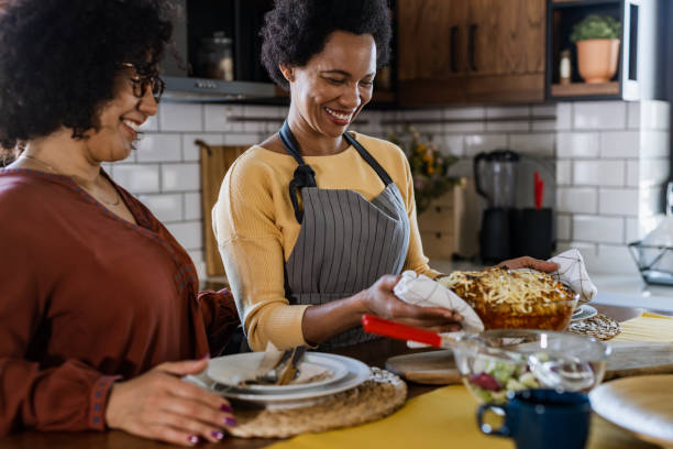 istock Happy lesbian couple cooking together 1386768391