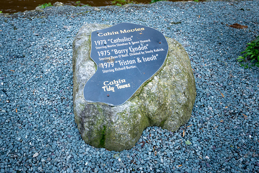 Stone plaque at Cahir Castle Ireland showing famous movies made at the site featuring famous actors Martin Sheehan, Ryan O'Neill, Richard Burton and director Stanly Kubrick.