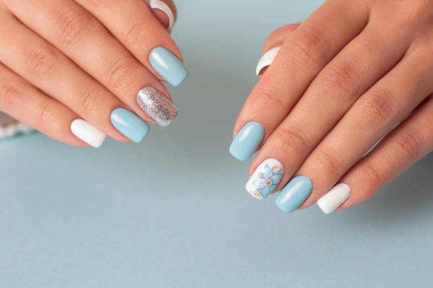 istock Female hands with romantic manicure nails 1386771767