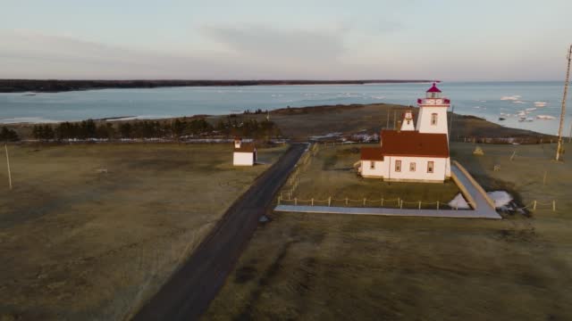 Flying over Wood Islands Lighthouse at sunset