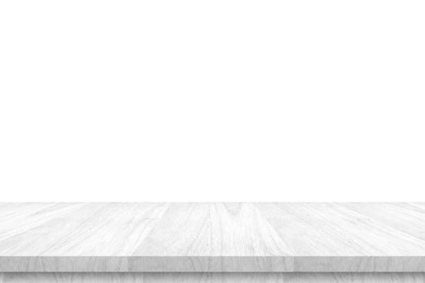 istock Empty white wooden table top isolated on white background 1386776787