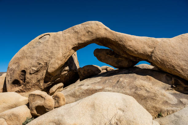 Arch Rock Against Blue Sky in Joshua Tree National Park