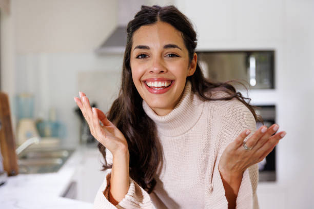 istock Young woman on video call in her kitchen 1386779712
