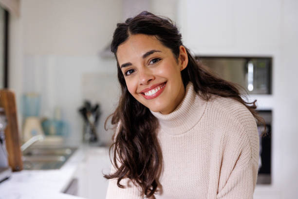 istock Young woman on video call in her kitchen 1386779717