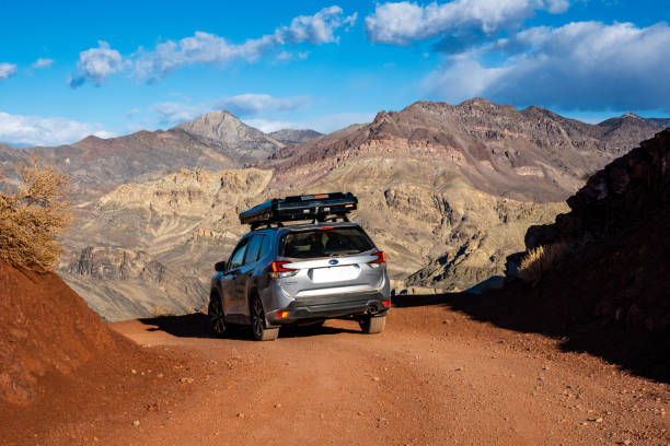 Subaru Forester With Rooftop Tent On Titus Canyon Road Death Valley National Park, United States: February 20, 2021: Subaru Forester With Rooftop Tent On Titus Canyon Road highlights the adventures one can have with a reliable vehicle in a National Park desert wash stock pictures, royalty-free photos & images