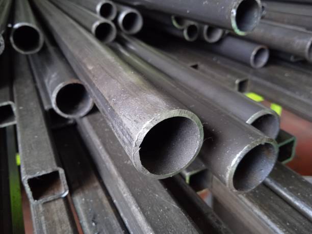 istock A pile of black long iron pipes placed on a shelf 1386788055