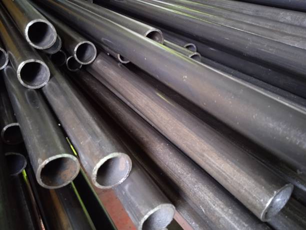 istock A pile of black long iron pipes placed on a shelf 1386788132