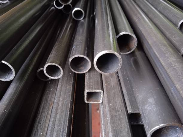 istock A pile of black long iron pipes placed on a shelf 1386788193