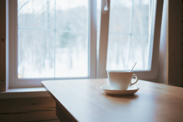 istock A cup on the table in front of the window. 1386791245