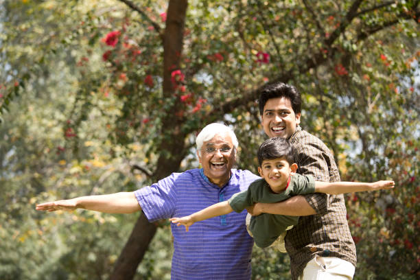 istock Three generation family having fun at park 1386802295