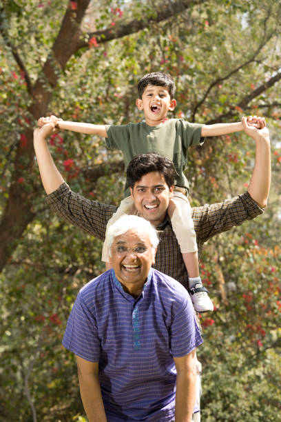 istock Three generation family having fun at park 1386802340
